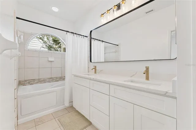 a view of a hallway with wooden floor and entryway