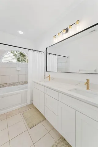 a view of staircase with white walls and empty room