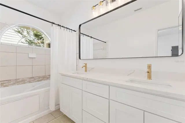 a bathroom with a sink and mirror