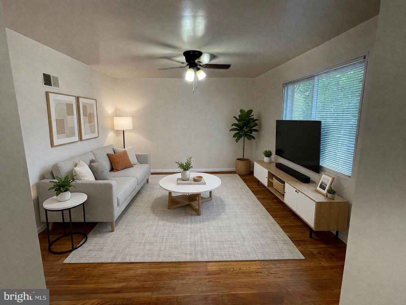 500 17th Street Northeast, Unit 6 Washington, DC 20002 - Photo 2 of 9 a living room with furniture and a flat screen tv