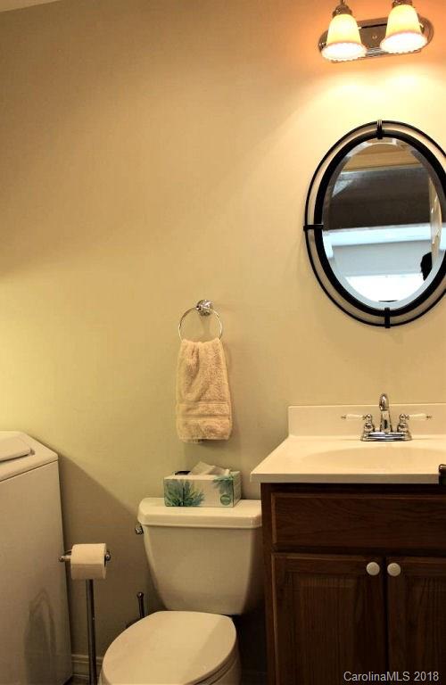 624 Carpenter Road Bryson City, NC 28713 - Photo 15 of 33 a bathroom with a sink a toilet and a mirror