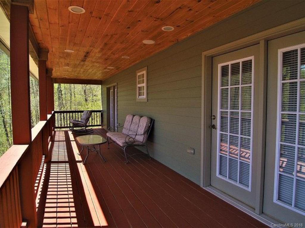 624 Carpenter Road Bryson City, NC 28713 - Photo 22 of 33 a balcony with wooden floor and furniture