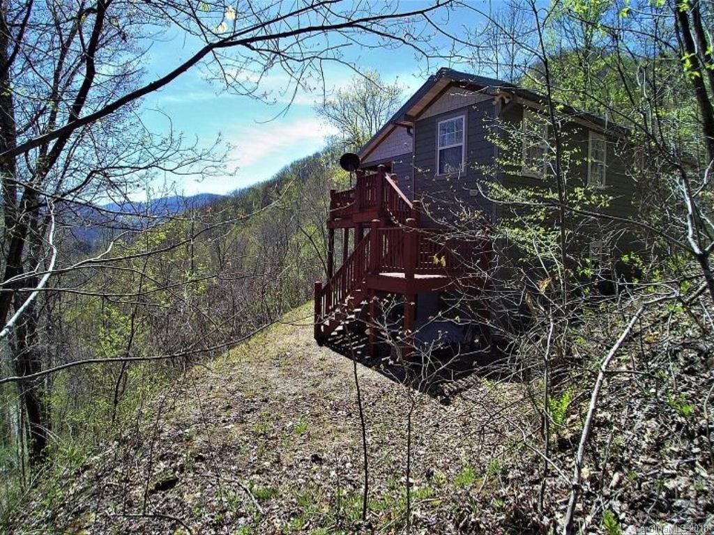 624 Carpenter Road Bryson City, NC 28713 - Photo 24 of 33 a view of a wooden house with a yard