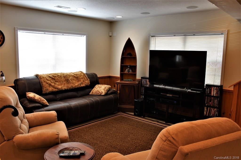 624 Carpenter Road Bryson City, NC 28713 - Photo 7 of 33 a living room with furniture and a flat screen tv