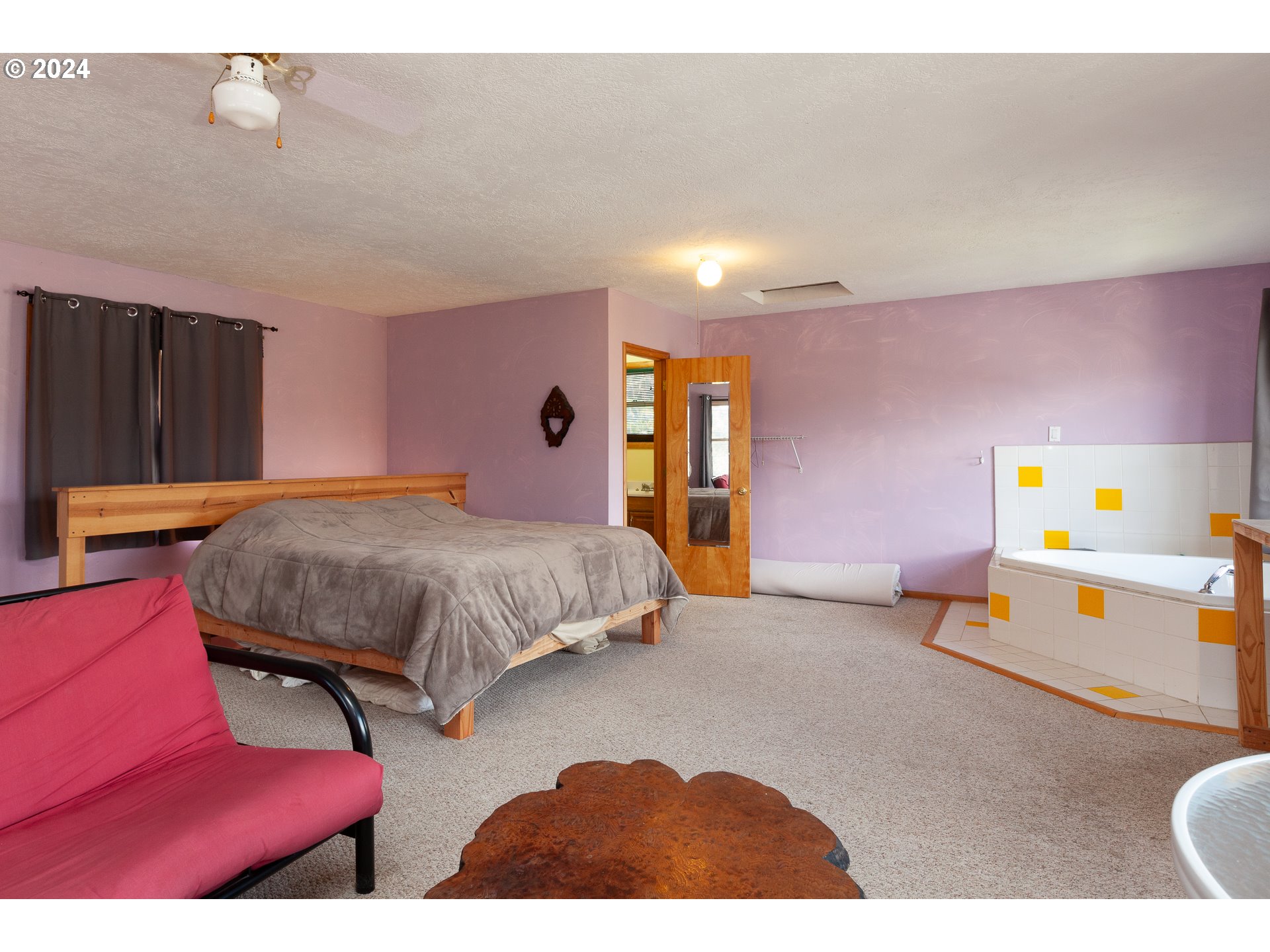 1 State Street Hood River, OR 97031 - Photo 20 of 47 a bedroom with a bed and wooden floor