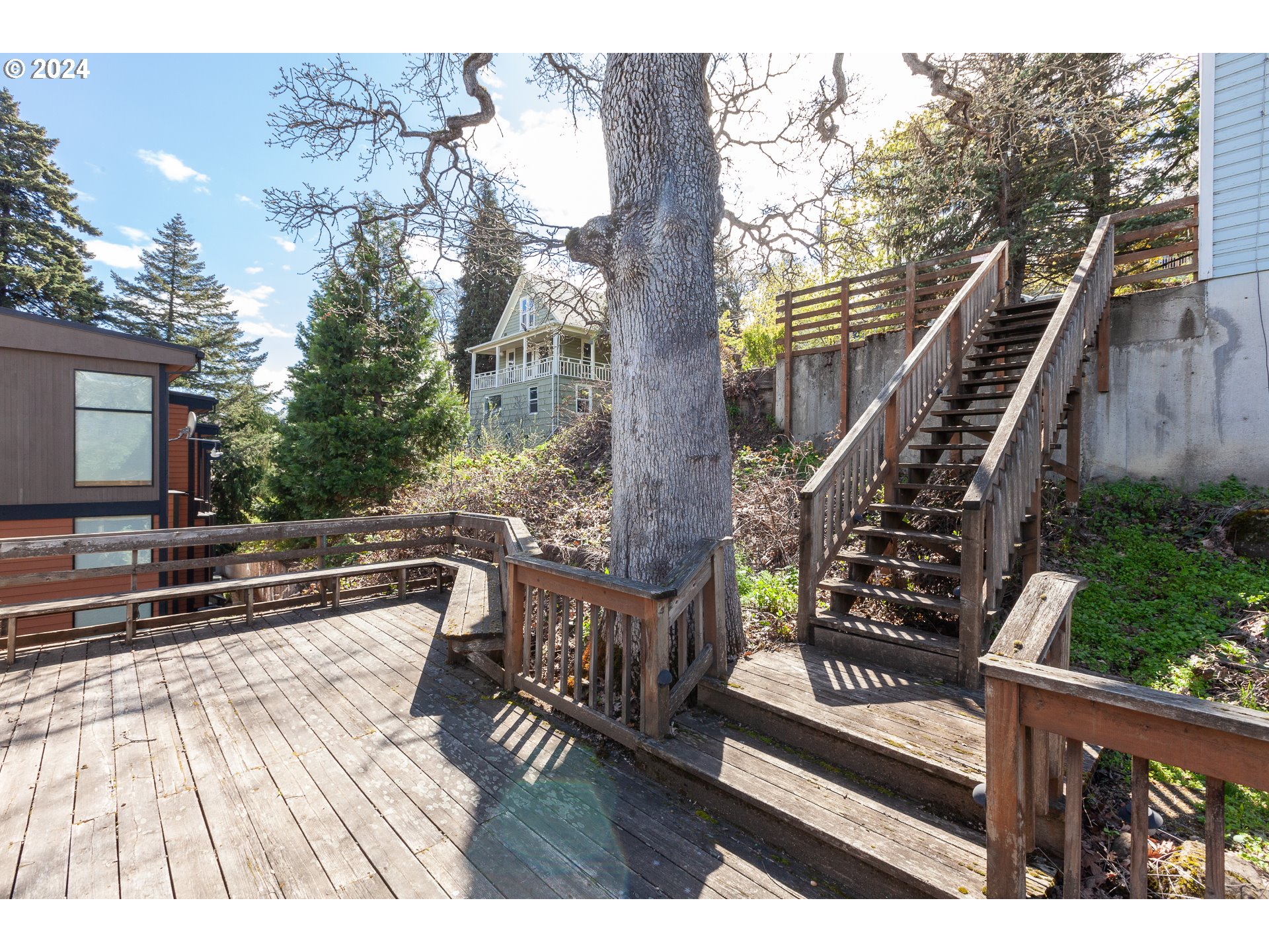 1 State Street Hood River, OR 97031 - Photo 23 of 47 a view of a patio with wooden floor and iron fence