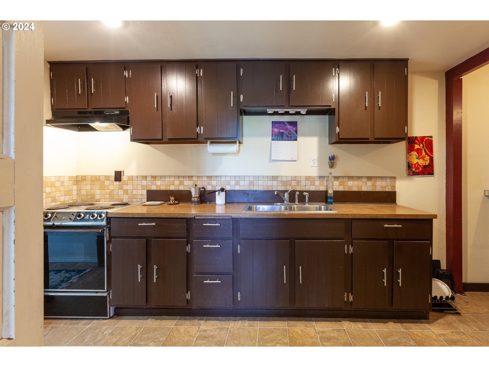 1 State Street Hood River, OR 97031 - Photo 39 of 47 a kitchen with granite countertop a sink cabinets and stainless steel appliances