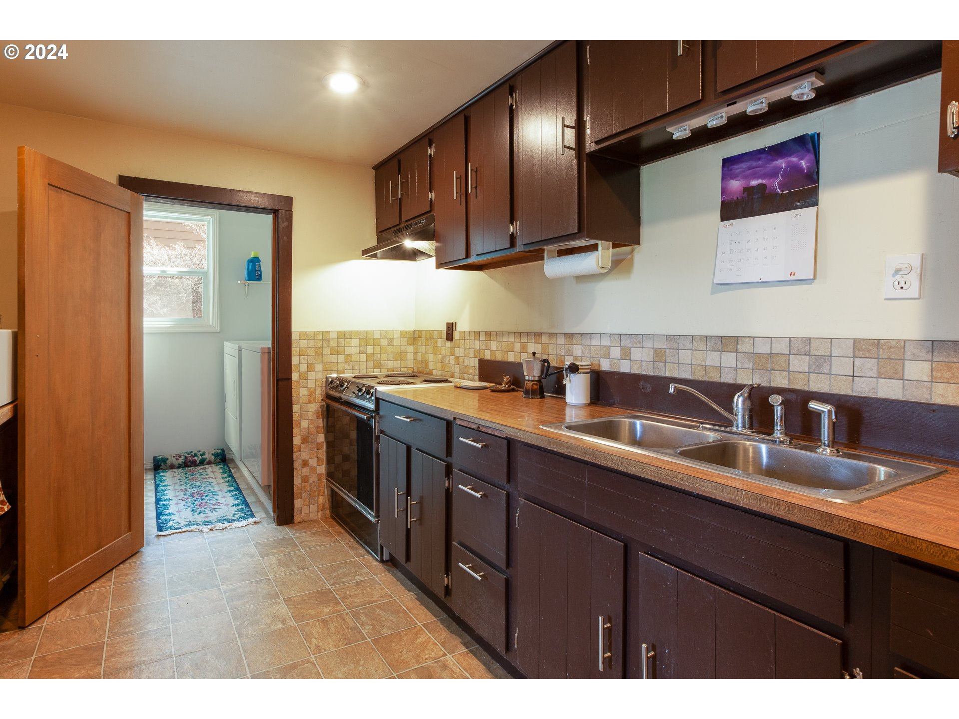 1 State Street Hood River, OR 97031 - Photo 40 of 47 a kitchen with stainless steel appliances granite countertop a sink stove and refrigerator