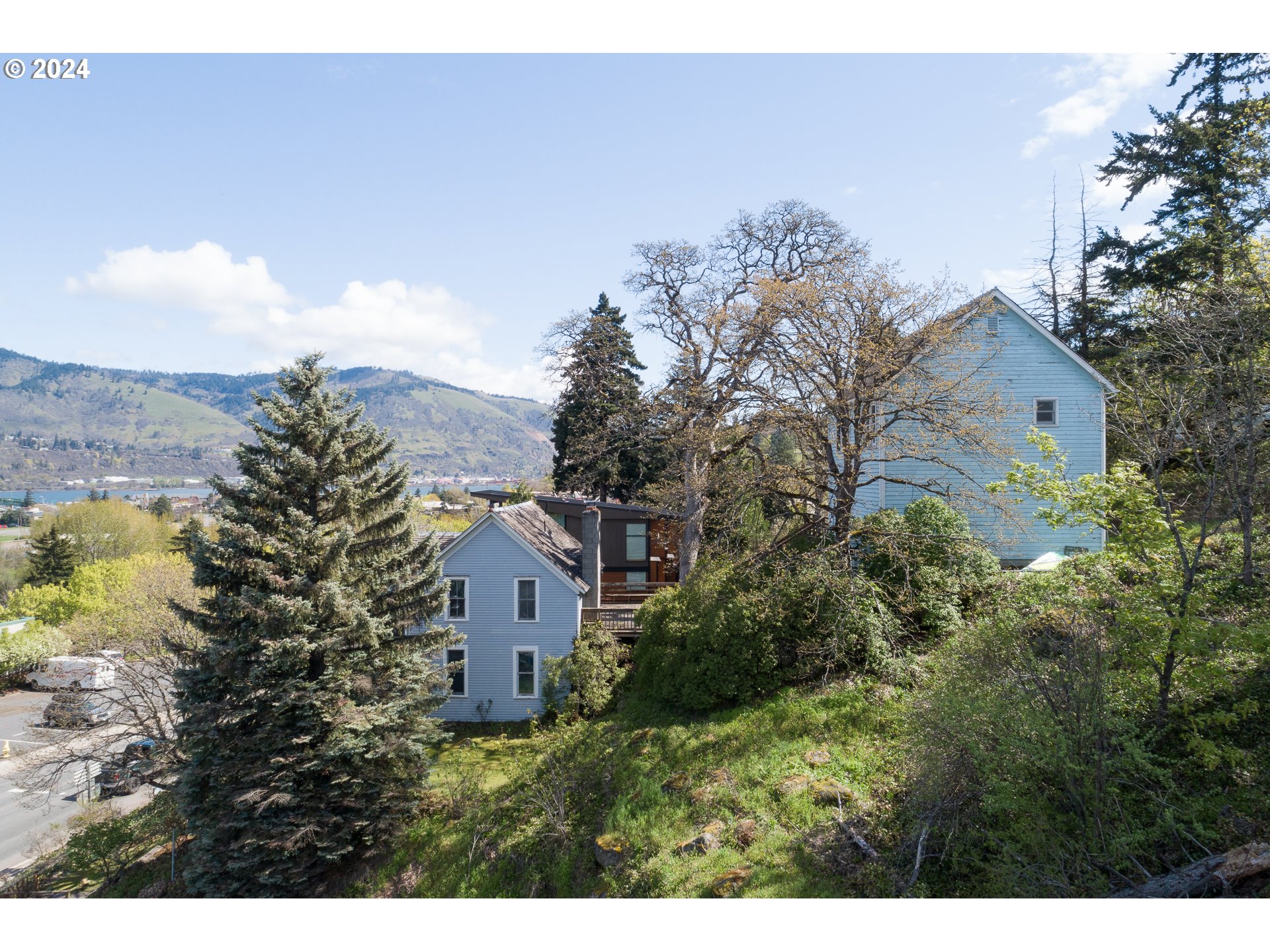 1 State Street Hood River, OR 97031 - Photo 7 of 47 a view of a house with a yard and a large tree