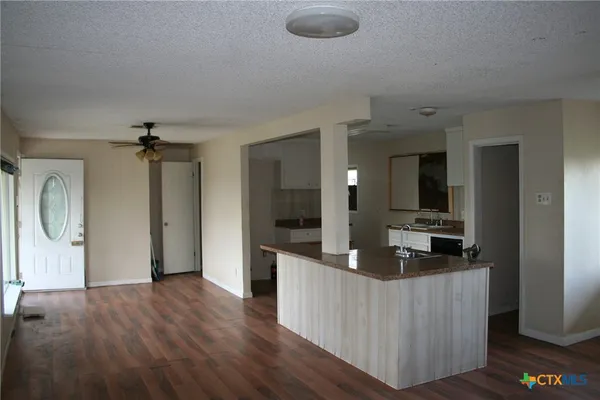 a kitchen with stainless steel appliances granite countertop a stove and a sink