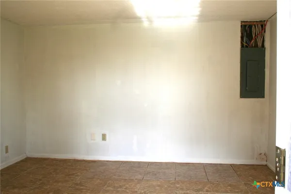 a kitchen with a refrigerator a stove a microwave and cabinets