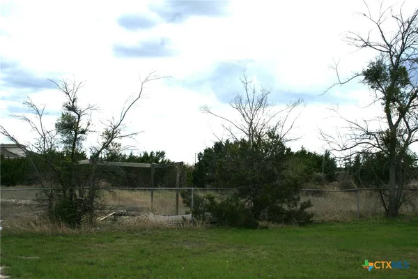 a view of lake with a yard