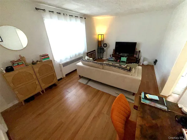 a living room with a couch and a flat screen tv