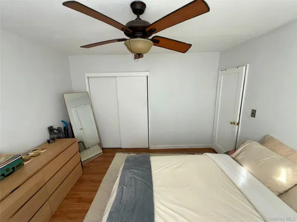 a bedroom with a bed and a rug