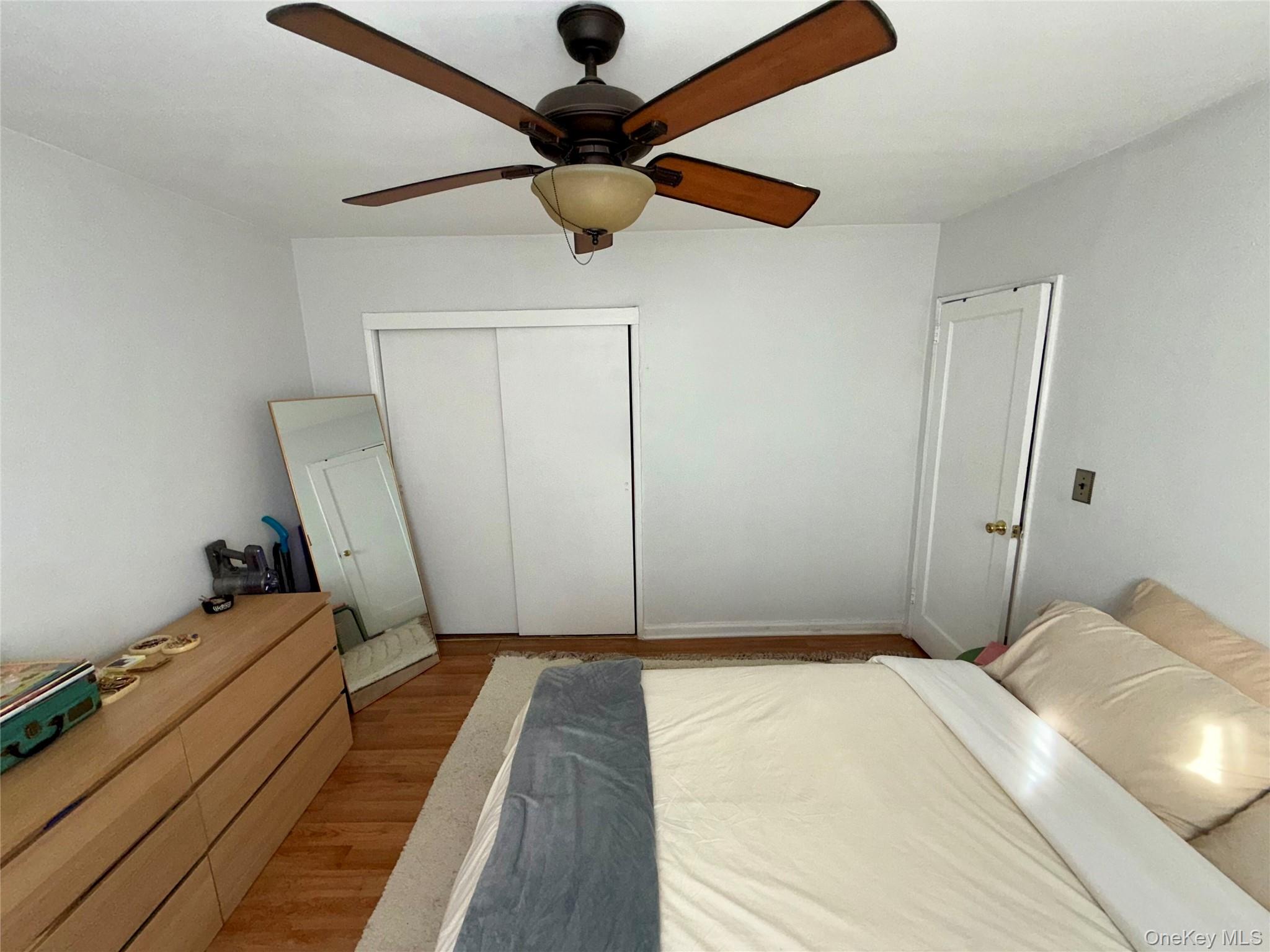 131-39 234th Street, Unit LL Queens, NY 11422 - Photo 5 of 10 a bedroom with a bed and a rug