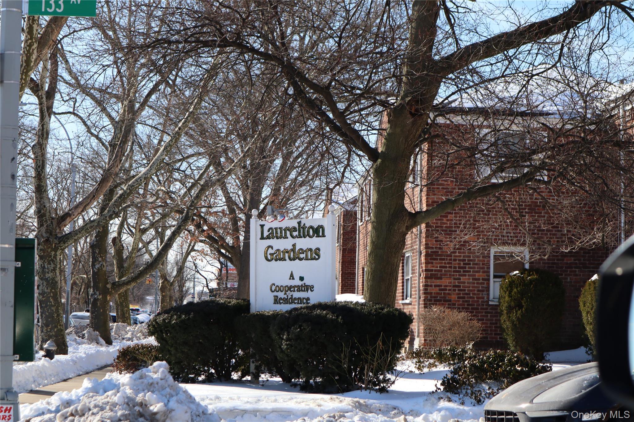 131-39 234th Street, Unit LL Queens, NY 11422 - Photo 10 of 10 a front view of a house with a yard