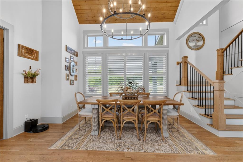 4726 Crestview Way Flowery Branch, GA 30542 - Photo 18 of 48 a dining room with furniture and a clock