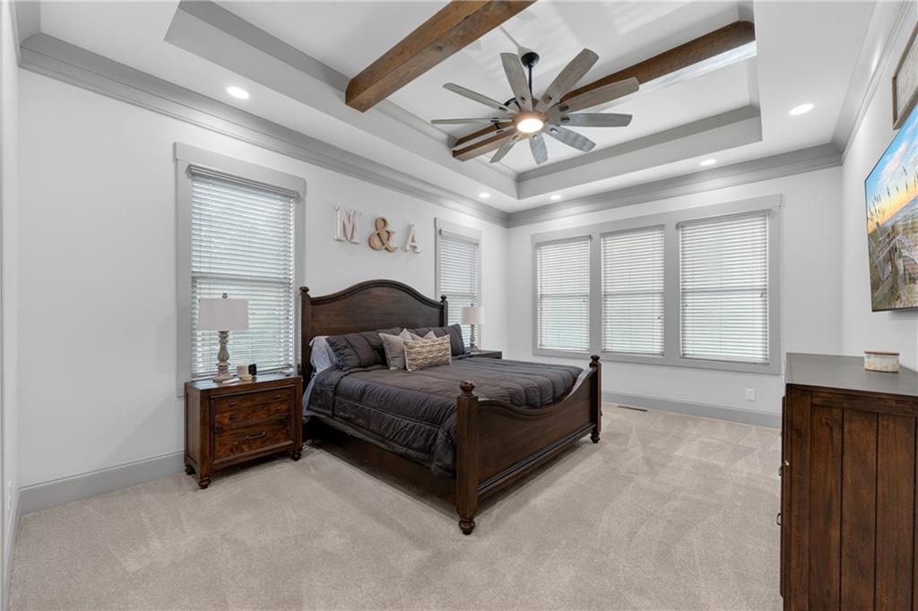 4726 Crestview Way Flowery Branch, GA 30542 - Photo 20 of 48 a living room with a bed furniture and a chandelier