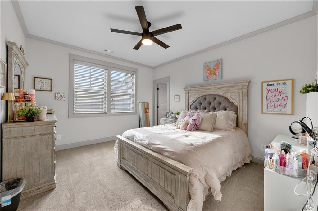 4726 Crestview Way Flowery Branch, GA 30542 - Photo 26 of 48 a bedroom with a bed dresser and a window