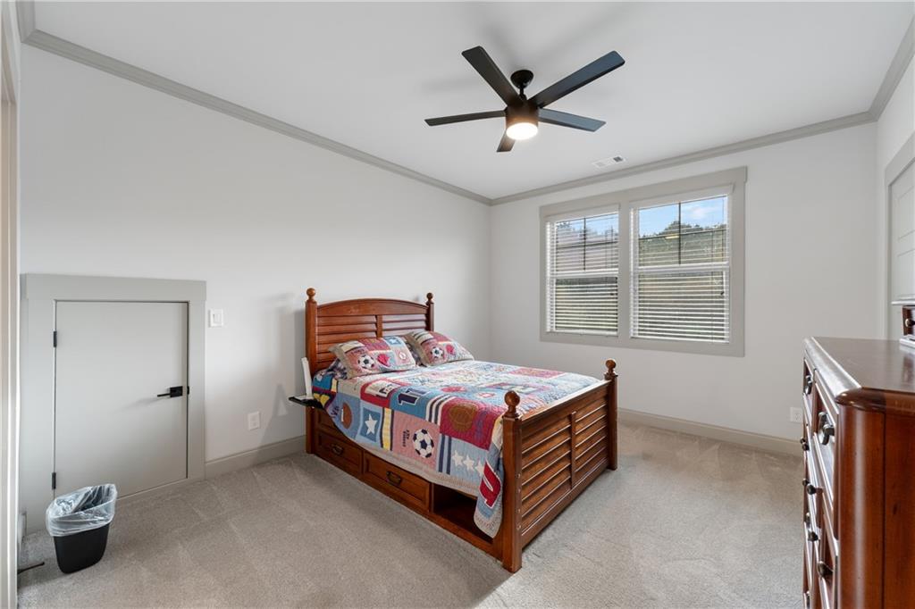 4726 Crestview Way Flowery Branch, GA 30542 - Photo 28 of 48 a bedroom with a bed and window