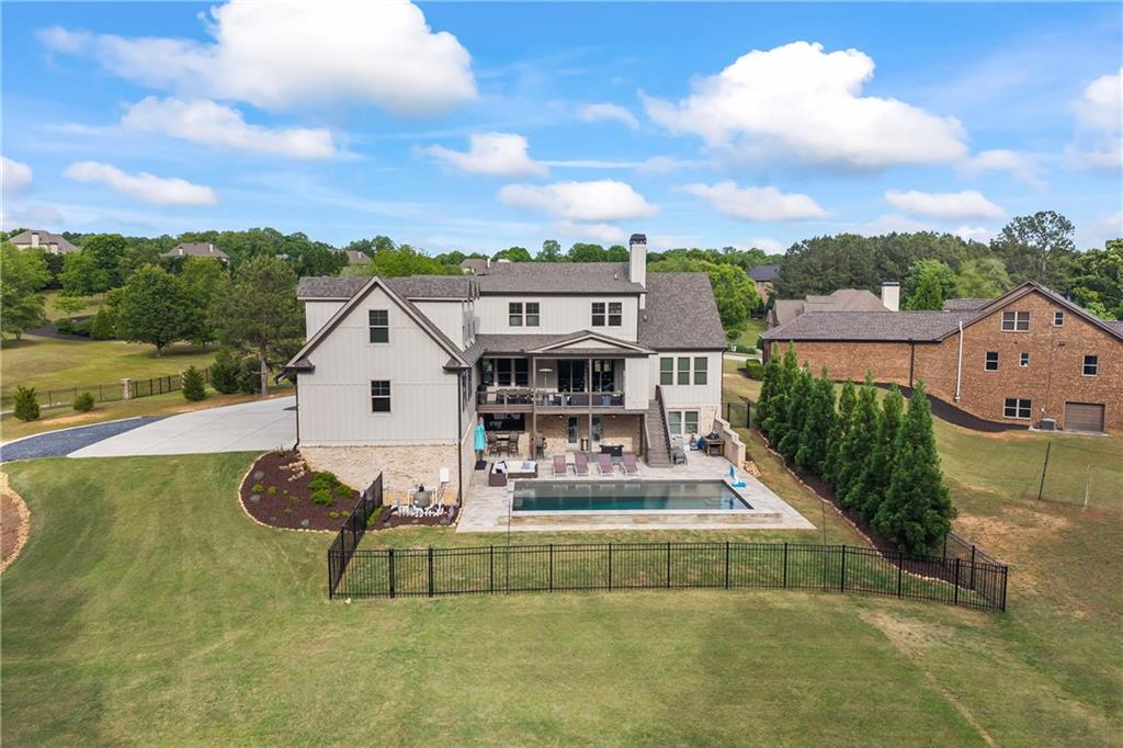 4726 Crestview Way Flowery Branch, GA 30542 - Photo 3 of 48 a view of houses with swimming pool and a yard