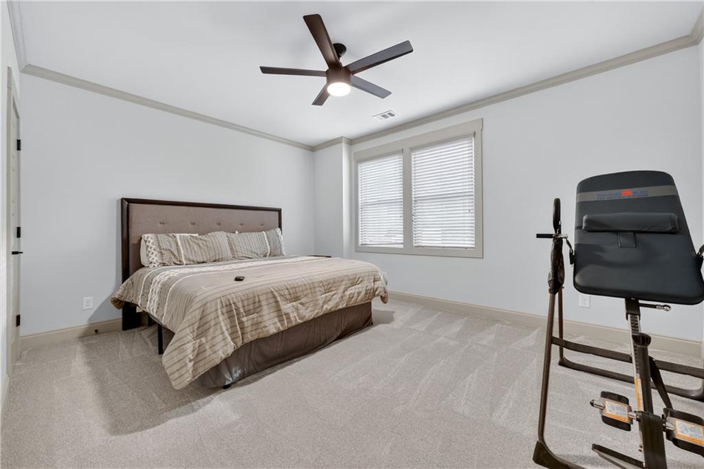 4726 Crestview Way Flowery Branch, GA 30542 - Photo 38 of 48 a bedroom with a bed and a window