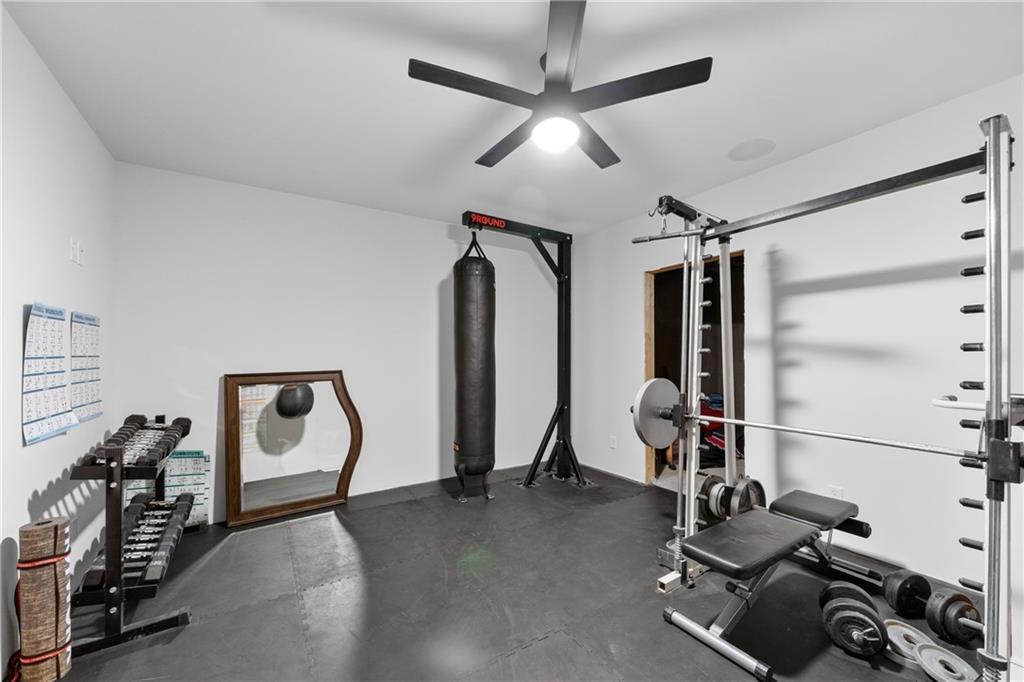 4726 Crestview Way Flowery Branch, GA 30542 - Photo 39 of 48 a view of a room with gym equipment