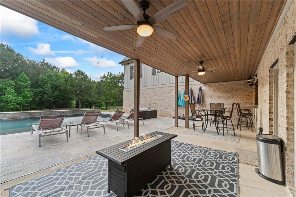 4726 Crestview Way Flowery Branch, GA 30542 - Photo 40 of 48 a outdoor space with lots of tables a garden and chairs