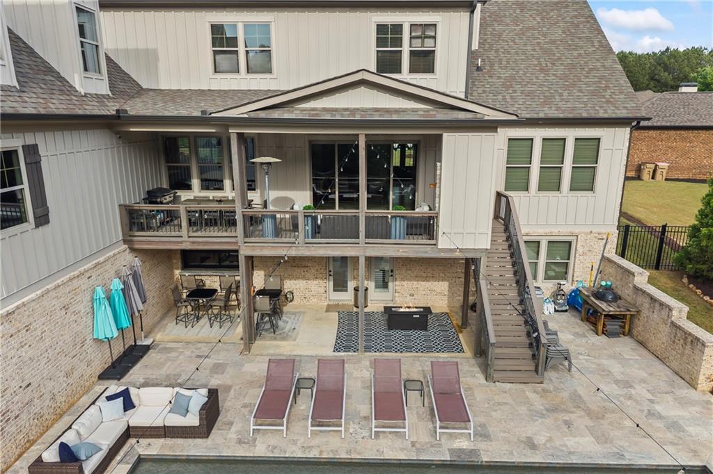 4726 Crestview Way Flowery Branch, GA 30542 - Photo 42 of 48 a view of a patio with table and chairs