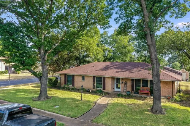 a view of a house with a garden