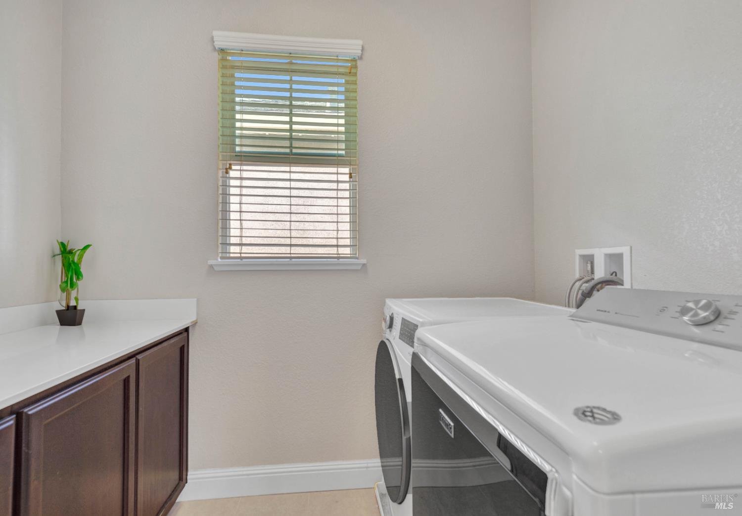 2861 Rio Seco Drive Bay Point, CA 94565 - Photo 39 of 45 Laundry room with cabinets and a window.