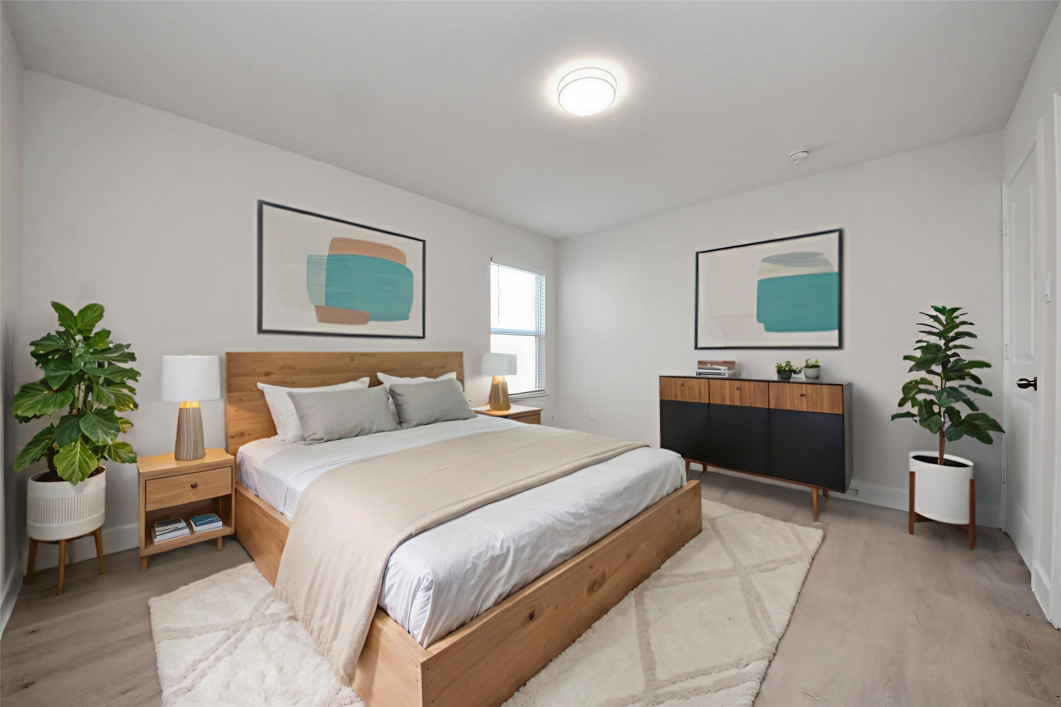 16124 Brettwood Lane Splendora, TX 77372 - Photo 15 of 40 a bedroom with a large bed and a potted plant