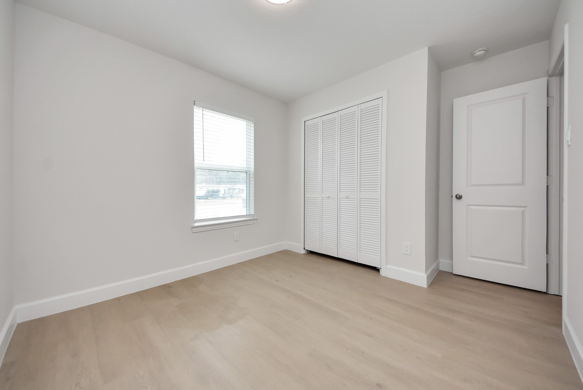 16124 Brettwood Lane Splendora, TX 77372 - Photo 21 of 40 an empty room with windows