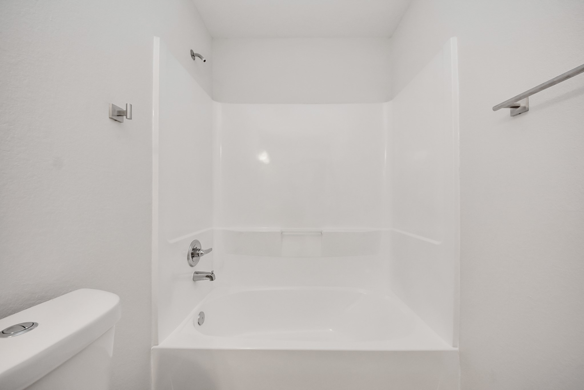 16124 Brettwood Lane Splendora, TX 77372 - Photo 24 of 40 a bathroom with a bathtub and shower