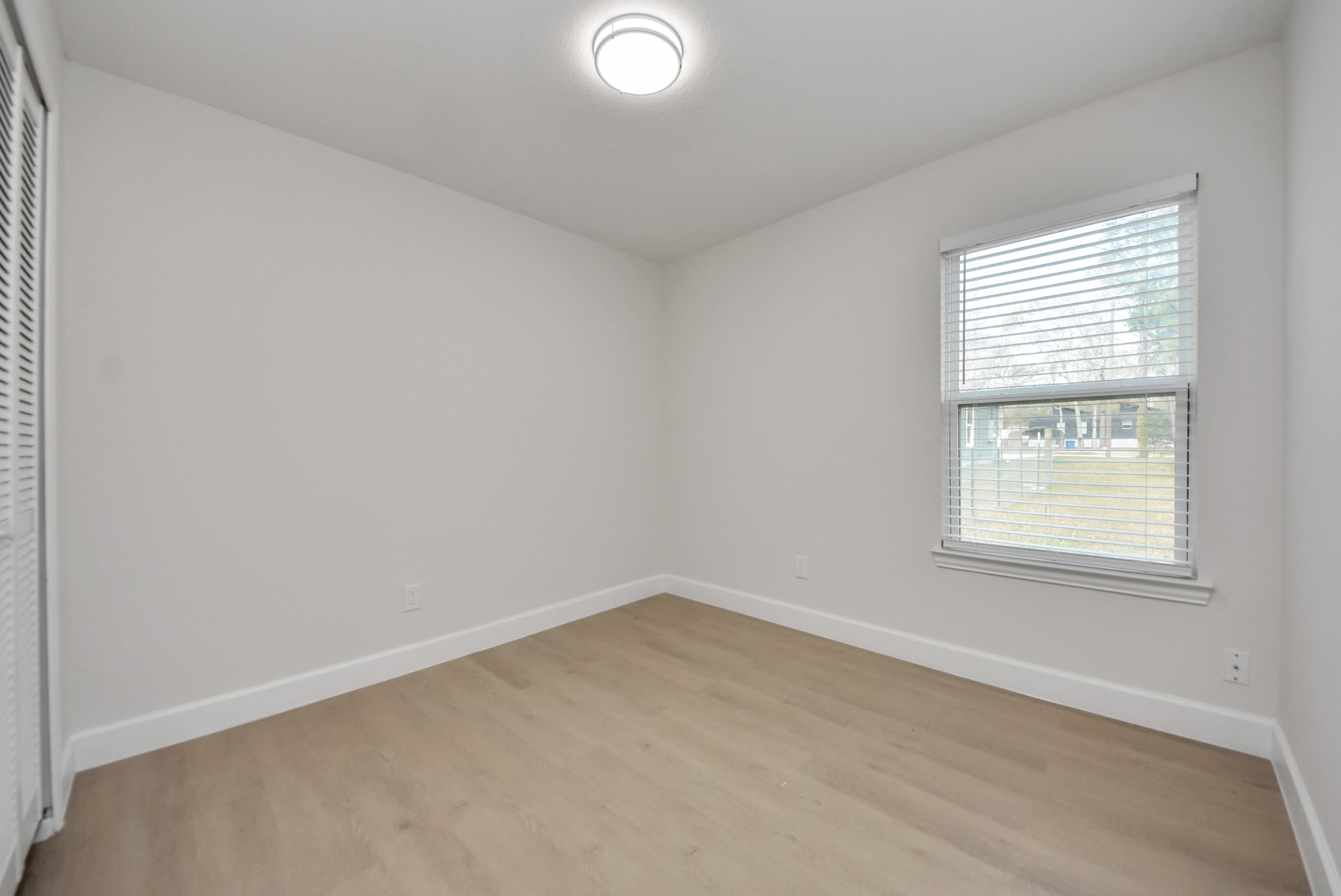 16124 Brettwood Lane Splendora, TX 77372 - Photo 25 of 40 an empty room with a window