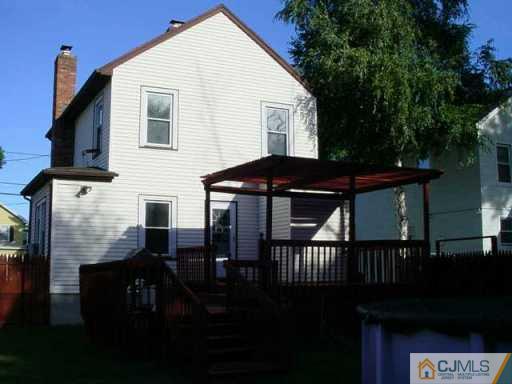 441 Front Street Dunellen, NJ 08812 - Photo 3 of 8 a view of house with backyard and sitting area