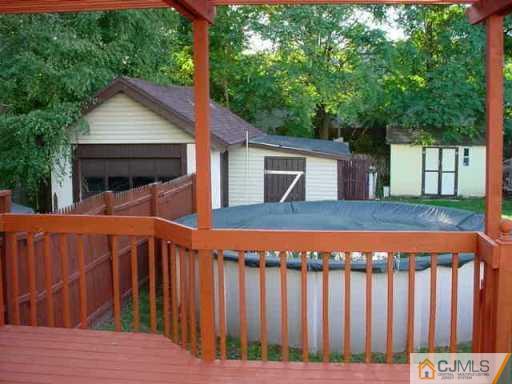 441 Front Street Dunellen, NJ 08812 - Photo 4 of 8 a view of a house with wooden fence