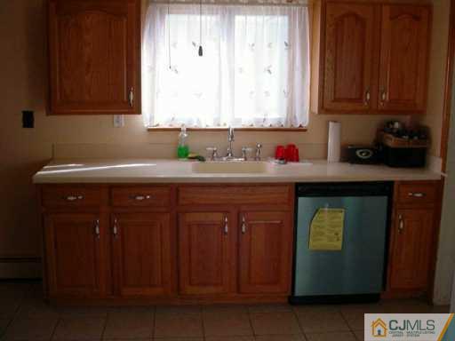 441 Front Street Dunellen, NJ 08812 - Photo 8 of 8 a kitchen with a sink and cabinets