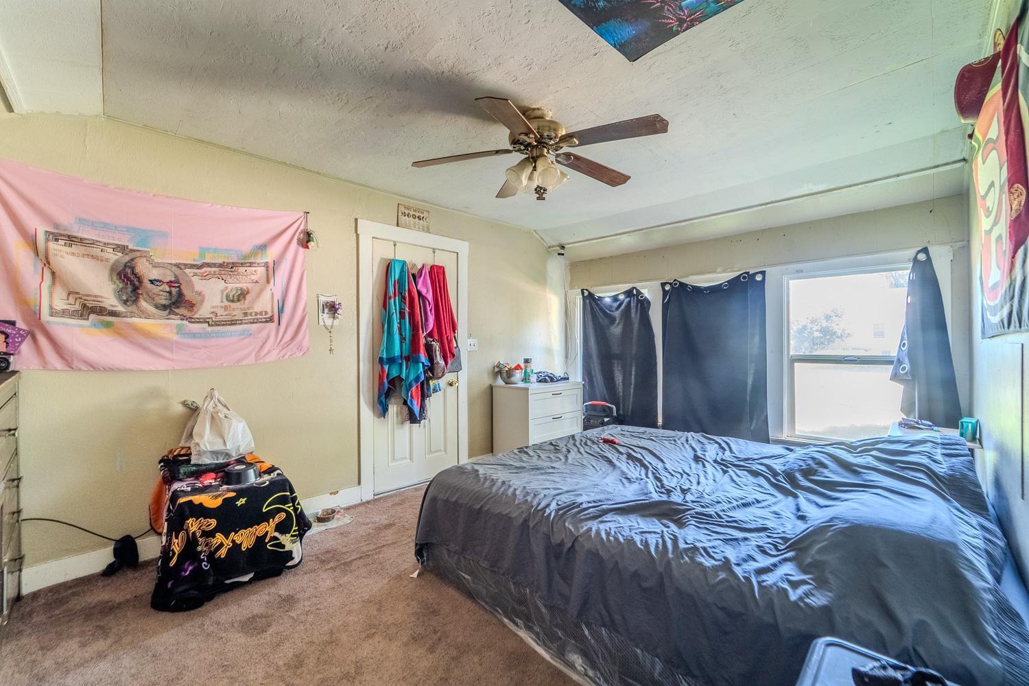 285 South Barrett Road Yuba City, CA 95991 - Photo 12 of 14 a bedroom with a bed and a large mirror