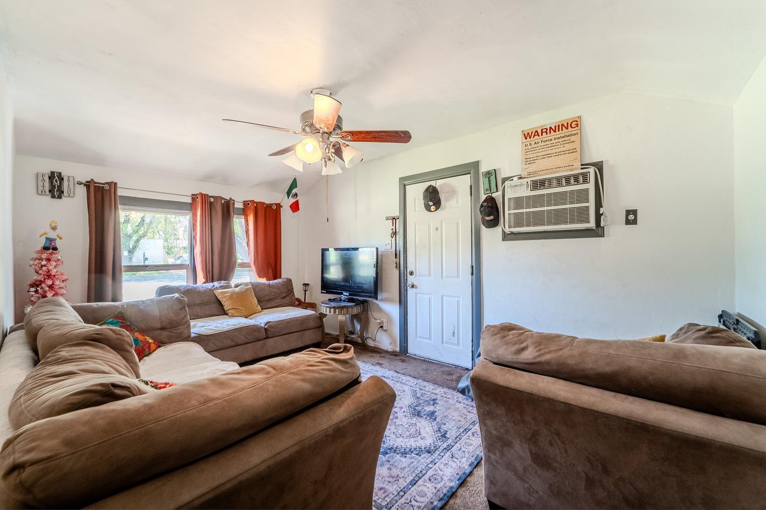 285 South Barrett Road Yuba City, CA 95991 - Photo 13 of 14 a living room with furniture and a chandelier