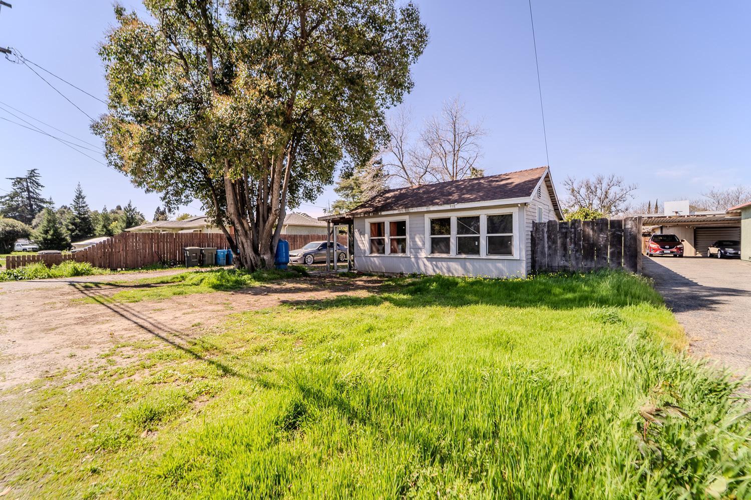 285 South Barrett Road Yuba City, CA 95991 - Photo 3 of 14 a front view of a house with a yard and large trees
