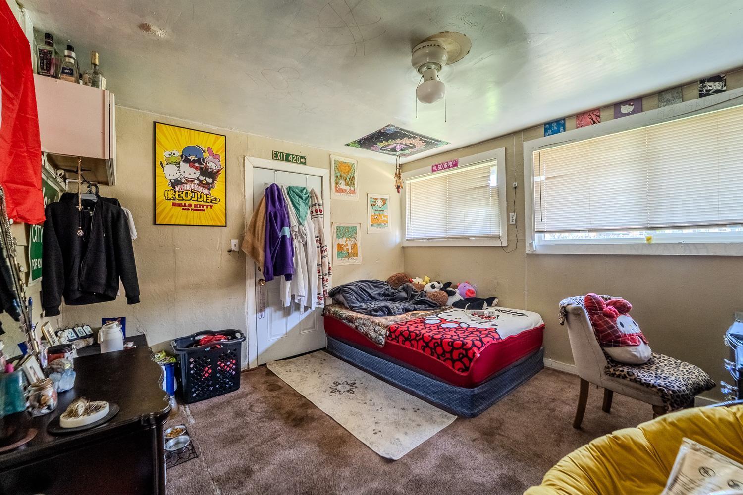 285 South Barrett Road Yuba City, CA 95991 - Photo 8 of 14 a bedroom with furniture and a flat screen tv