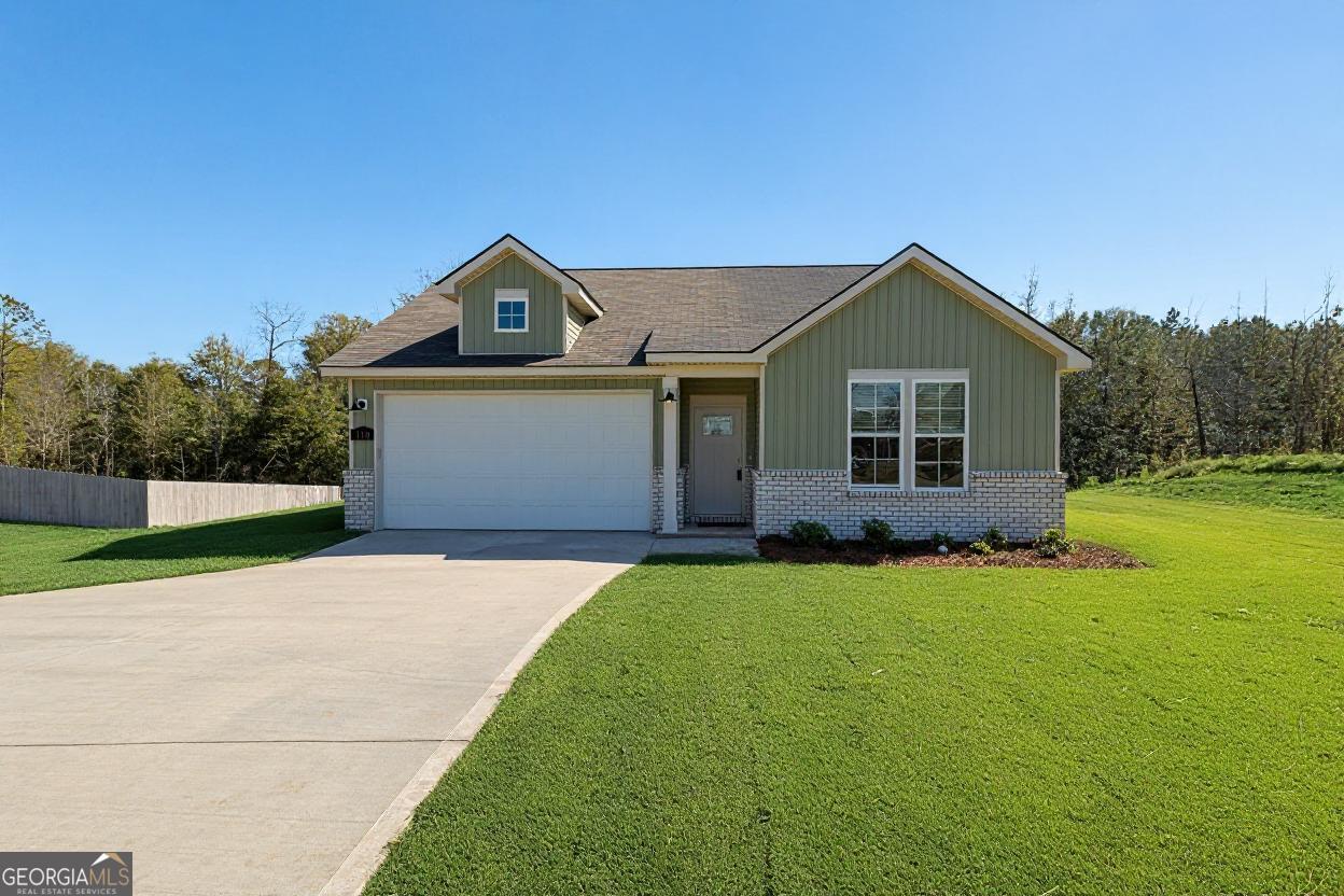 a front view of a house with yard