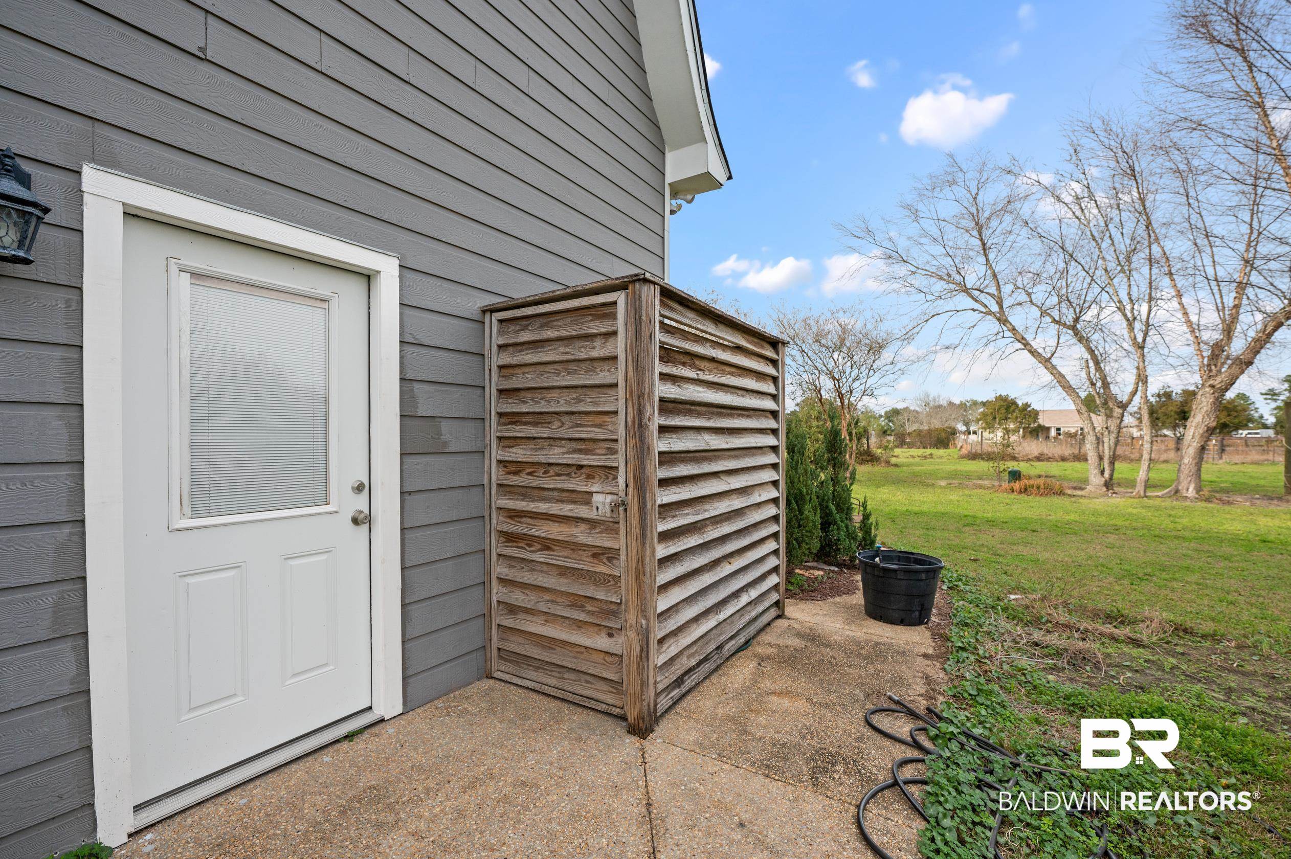 13358 County Road 91 Elberta, AL 36530 - Photo 32 of 47 Doorway to property with a lawn