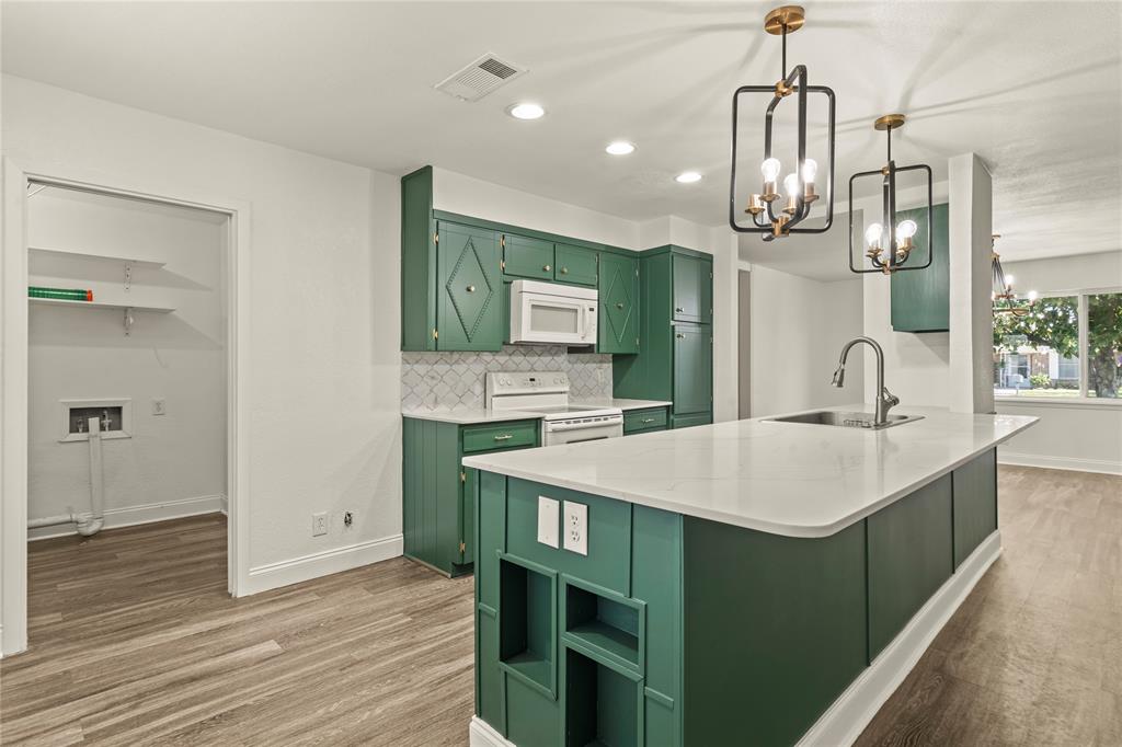 104 East Santa Anna Street Robinson, TX 76706 - Photo 18 of 36 a kitchen with a sink a counter space and stainless steel appliances
