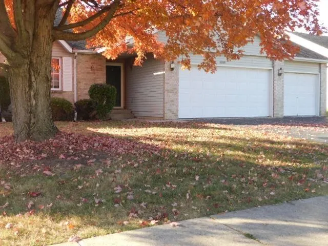 a backyard of house with large trees