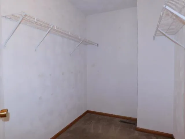 a view of a room with racks on the wall