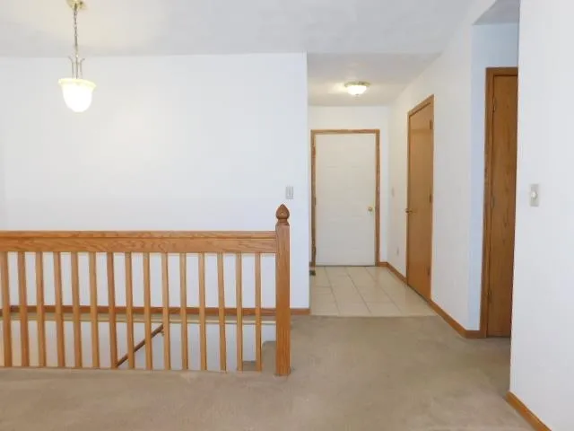 a view of hallway with stairs