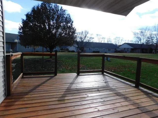 a view of outdoor space with deck and yard