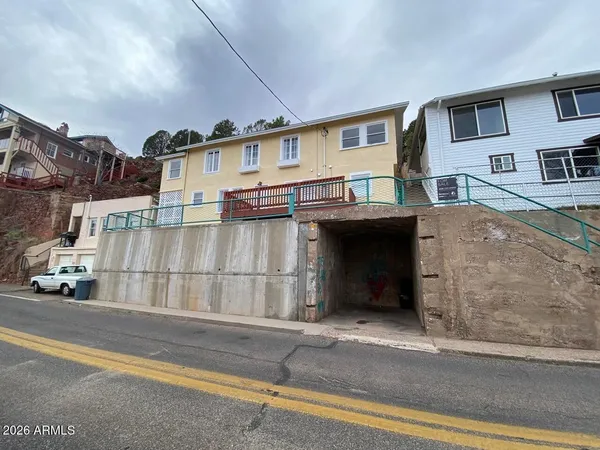 a view of a house with a street